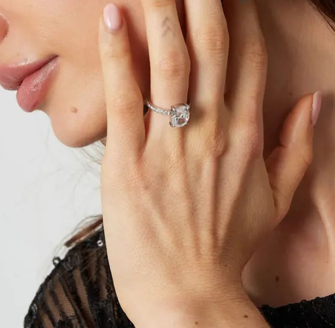 Silver ring with an oval cut zirconia stone that resembles a luxurious diamond - Lavina