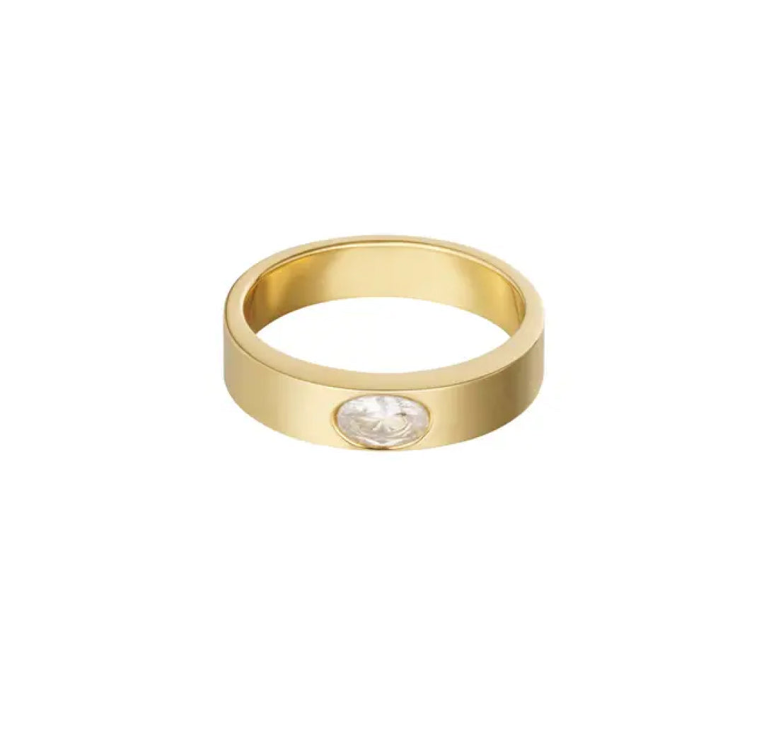 Gold ring with alight color pink beige zirconia stone set in the center middle of the band - Lavina